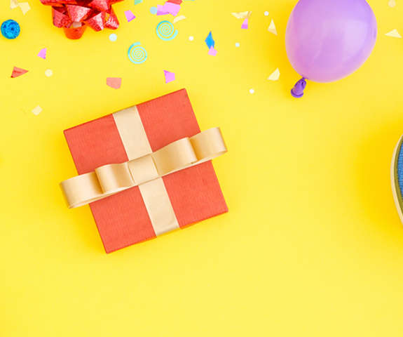 a birthday scenery with balloons and ribbons
