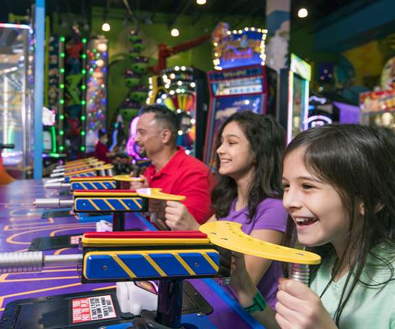 Family playing in the arcade